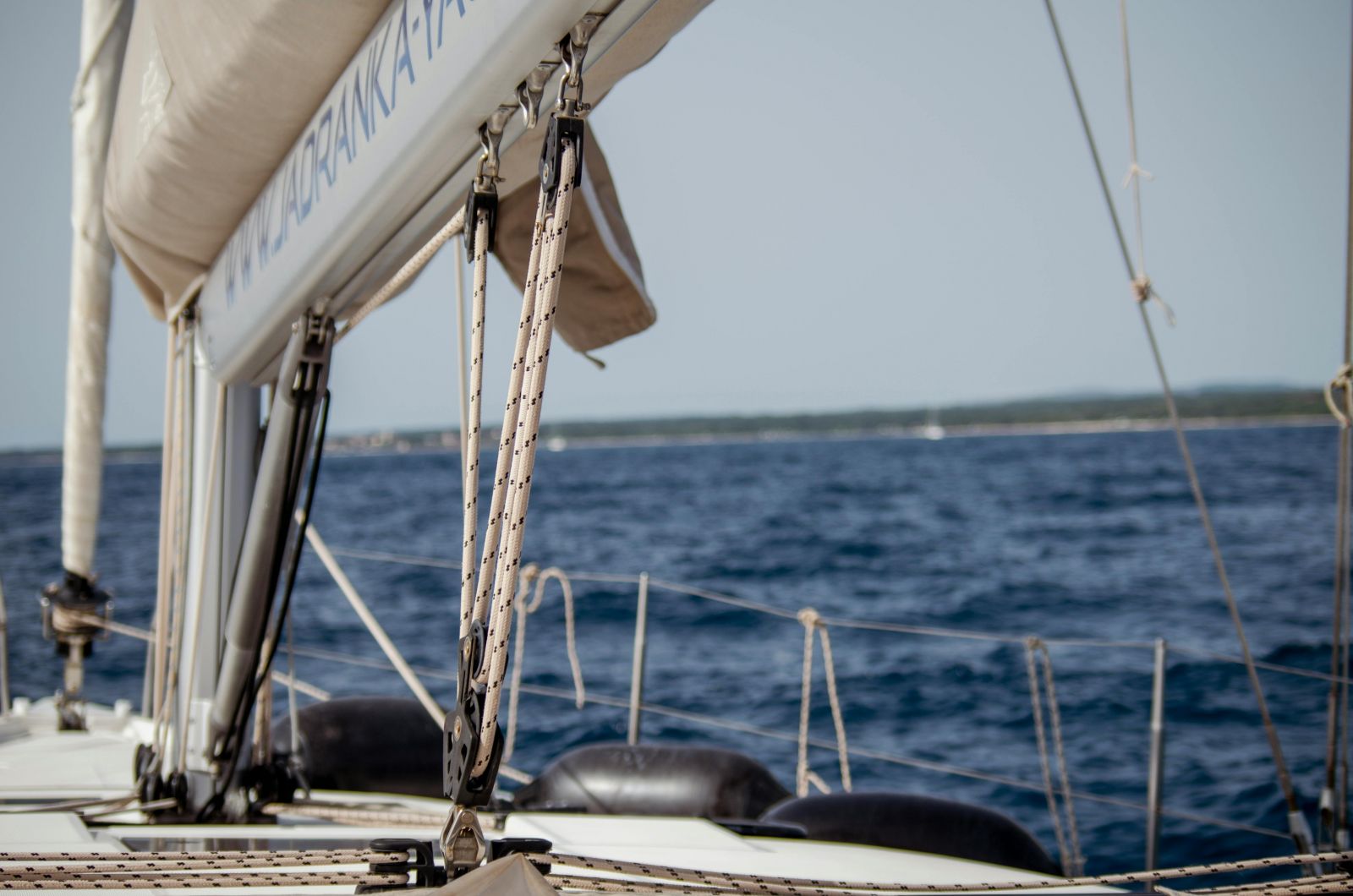 Photo by Daniel Petschniker: https://www.pexels.com/photo/close-up-of-ropes-on-sailboat-12897941/